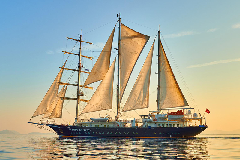 Yacht running on waves